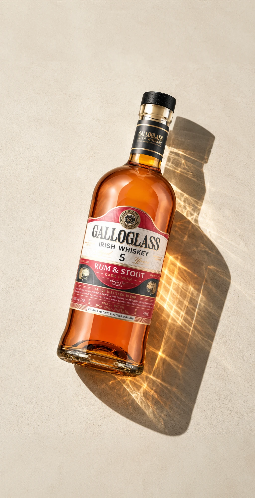 Galloglass 5 Year Rum and Stout bottle lying in sunlight